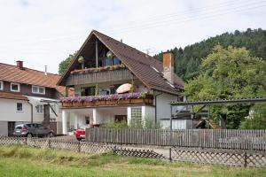 a house with flowers on the front of it at Ferienwohnung Paffendorf in Gutach