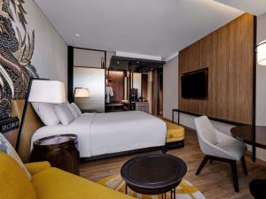 Postel nebo postele na pokoji v ubytování Pullman Bandung Grand Central