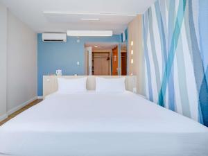 Cama o camas de una habitación en Mercure Rio de Janeiro Barra da Tijuca