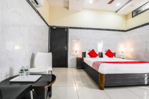 Voodi või voodid majutusasutuse Super Hotel O Src Grand toas