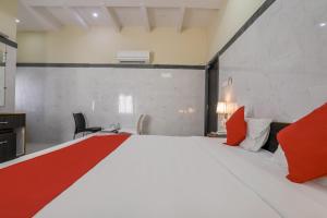 Voodi või voodid majutusasutuse Super Hotel O Src Grand toas