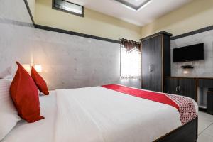 Voodi või voodid majutusasutuse Super Hotel O Src Grand toas