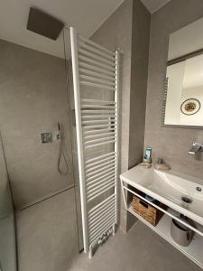 a bathroom with a shower and a sink at Apartmán Máj 104 in Pec pod Sněžkou +17 photos