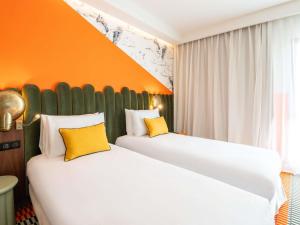 Postel nebo postele na pokoji v ubytování Mercure Shéhérazade Rabat