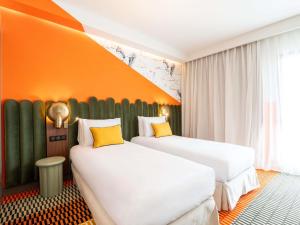 Postel nebo postele na pokoji v ubytování Mercure Shéhérazade Rabat