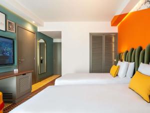 Postel nebo postele na pokoji v ubytování Mercure Shéhérazade Rabat