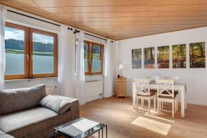 a living room with a couch and a table at Ferienwohnung Landliebe in Niederbach