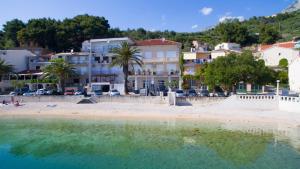 a view of the beach and buildings at Apartments Sumic Podgora in Podgora