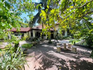 a house with a picnic table in front of it at Krishan Villa in Negombo