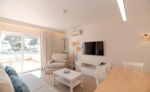 a living room with a couch and a table at Pestana Alvor Beach Villas Seaside Resort in Alvor