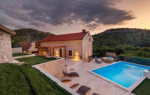 a villa with a swimming pool and a house at Villa Marina Neretva by Villas Guide in Metković