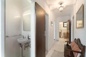 a bathroom with a sink and a toilet and a mirror at Casa Mara in Tacoronte +28 photos