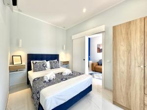 a bedroom with a large bed in a room at Almancil Typical House by Homing in Almancil