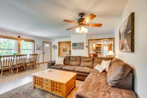 a living room with a couch and a table at 3 Mi to Gunstock Mountain Resort Gilford Getaway in Gilford