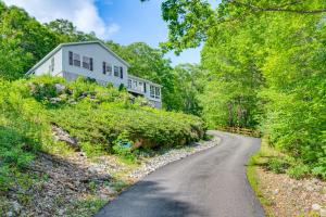 a house on a hill next to a road at 3 Mi to Gunstock Mountain Resort Gilford Getaway in Gilford