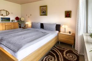 a bedroom with a large bed and two night stands at Sophie -203- in Mittenwald