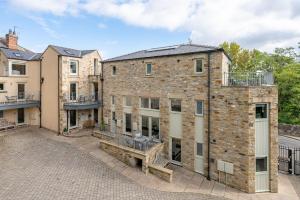an exterior view of a large brick building at No 5 Darcy Mews in Richmond