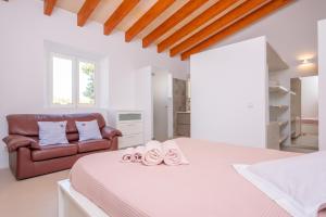 a white bedroom with a bed and a couch at El Paraiso (Porto Cristo) in Porto Cristo +36 photos