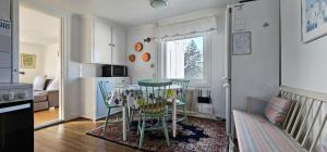 a kitchen with a table and chairs in a room at Large House with Two Apartments in Central Skarhamn in Skärhamn