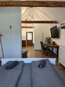 a living room with a couch and a table at Somló Éden in Somlószőlős