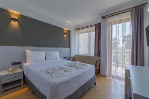 Postel nebo postele na pokoji v ubytování Dream of Oludeniz Hotel -All inclusive