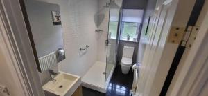 a small bathroom with a sink and a toilet at House Sleeps6-Garden-PetsOk-Parking-Long stay disc in Nottingham +9 photos
