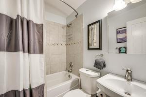 a bathroom with a white toilet and a sink at Cozy-Chic Condo with Mtn Views 3 Mi to Slopes! in Winter Park +27 photos