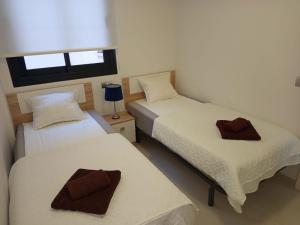 En eller flere senge i et værelse på Apartament Dariusz Torrevieja + 10 billeder