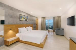 a hotel room with a bed and a television at D Square Statue of Unity Kevadia, a member of Radisson Individuals in Kevadia +36 photos