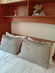 Łóżko lub łóżka w pokoju w obiekcie Antemma Apartment