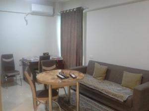 a living room with a couch and a table at Princess resort unit number 260A Markos in Hurghada