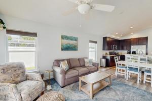 a living room with a couch and a table at Terrapin Station in Ormond Beach