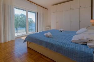 Postel nebo postele na pokoji v ubytování Apartment in Crikvenica 39237