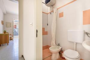 Koupelna v ubytování Appartamento Oscar Mancaversa + 25 fotografií