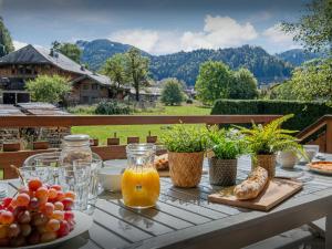 a table with food and drinks on top of a balcony at Chalet Bolay in Montriond