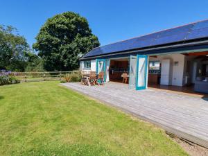 a house with a deck with a solarium at Little Chywoon Barn in Truro