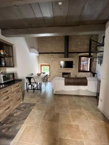 a bedroom with a bed and a table in a room at Le Mura - rooms and apartments in Norcia