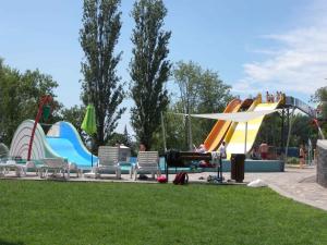 a water park with a water slide and slides at Apartment Balatonboglar 7 in Balatonboglár