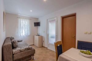 a living room with a couch and a table at Holiday home Stari Grad - Insel Hvar 6341 in Stari Grad