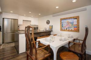 a kitchen and dining room with a table and chairs at Crestview Place Unit 507 in Winter Park