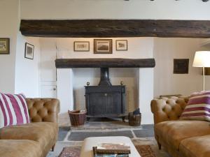 a living room with two couches and a fireplace at Staveley Park - Uk33713 in Staveley