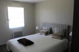 En eller flere senge i et værelse på Petit coin paisible entre terre et mer