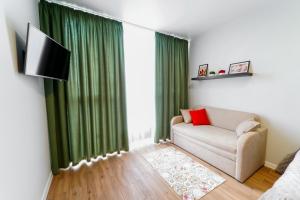 Μια τηλεόραση ή/και κέντρο ψυχαγωγίας στο Апартаменти MYFREEDOM ЖК Місто Квітів поруч із метро Сирець