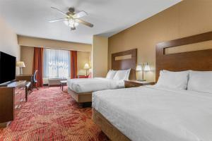 a hotel room with two beds and a flat screen tv at Best Western Plus Ruidoso Inn in Ruidoso +31 photos