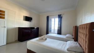 Katil atau katil-katil dalam bilik di Hotel Le Gardenia (ex Lutetia)
