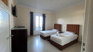 Katil atau katil-katil dalam bilik di Hotel Le Gardenia (ex Lutetia)