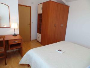 Vuode tai vuoteita majoituspaikassa Apartment Liznjan 1