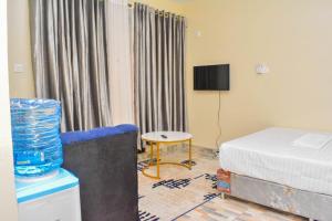 Postel nebo postele na pokoji v ubytování Brima Mangu Apartments, Blue Pacific Studio