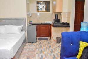 Kuchyň nebo kuchyňský kout v ubytování Brima Mangu Apartments, Blue Pacific Studio