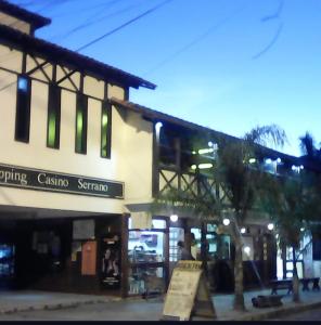 a building with a sign in front of it at Hotel da Vila in Nova Friburgo